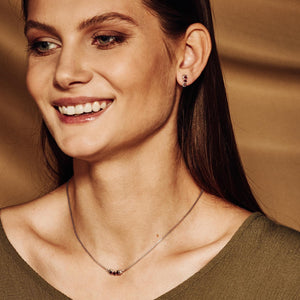 model wearing San Shi Garnet Stud Earrings and necklace set, Sterling Silver - Tsai x Tsai | Luxury Gemstone Jewellery Gift