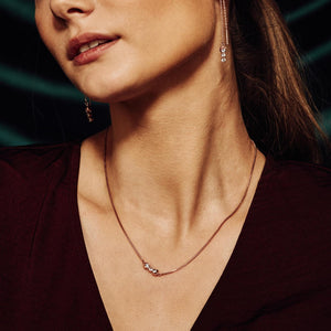 model wearing San Shi Blue Topaz Necklace and chain earring set, 18 ct Rose Gold Vermeil - Tsai x Tsai | Luxury Gemstone Jewellery Gift